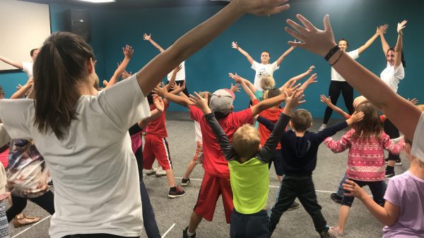 Children participating in lesson with GCU's Elementary Dance Tour cast