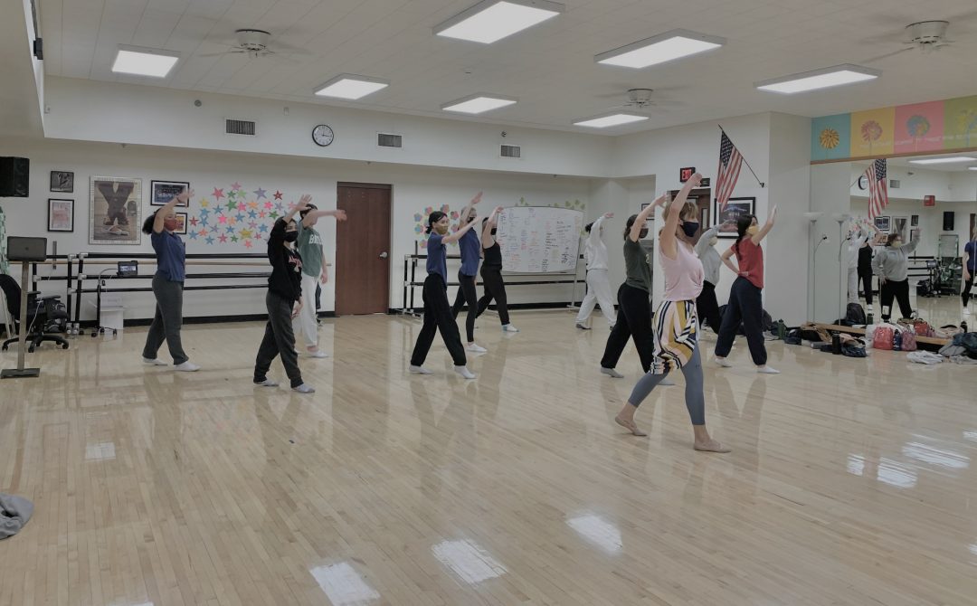 Sukie teaches high school students in a brightly lit dance studio at Xavier College Preparatory.